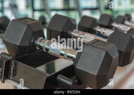 dumbbells in the gym at sports club for exercise and Bodybuilding Stock Photo