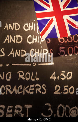 UK, England, London, Kensington, The Churchill Arms Pub with Union Jack bunting  to celebrate the Queens Diamond Jubillee,  Fish and chip menu written on blackboard Stock Photo