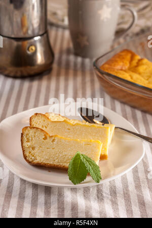 appetizing cottage cheese casserole and cups Stock Photo
