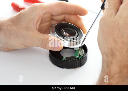 optician works on device Stock Photo