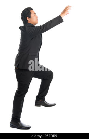 Asian businessman hand grabbing something Stock Photo