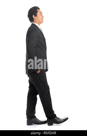 Side view Asian male walking Stock Photo