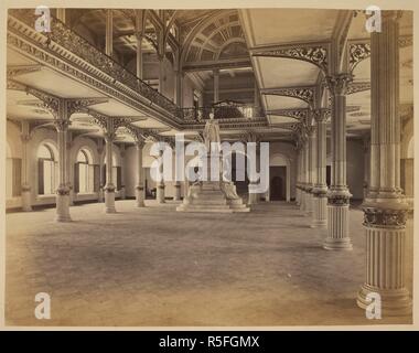[Interior of] The Victoria and Albert Museum, [Bombay]. A view looking along the hall towards Noble's statue of Prince Albert. Album of 'Views of Western India'. c. 1872. Photograph. Source: Photo 140/(36). Stock Photo