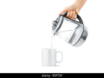 Blank white ceramic mug with hot teapot mock up, isolated, front view. Clear drink cup with teakettle mockup. Sensitive kitchen utensil in arm template. Brew beverage in thermal crockery. Stock Photo