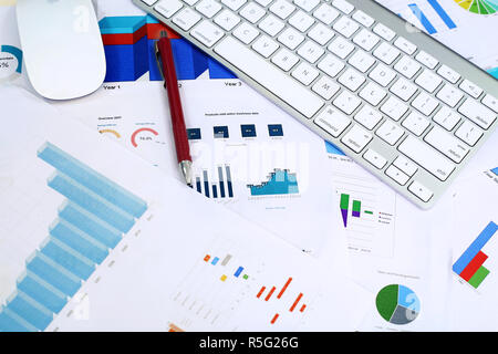 Picture of mouse, keyboard and pen on the graph paper. Stock Photo