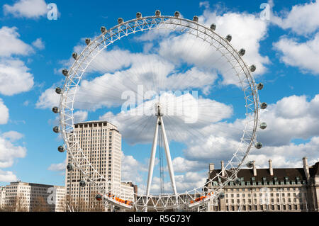 London, United Kingdom - March 22, 2014: London's famous ferris wheel called the London Eye or Millennium Wheel, as seen from across the river Thames  Stock Photo
