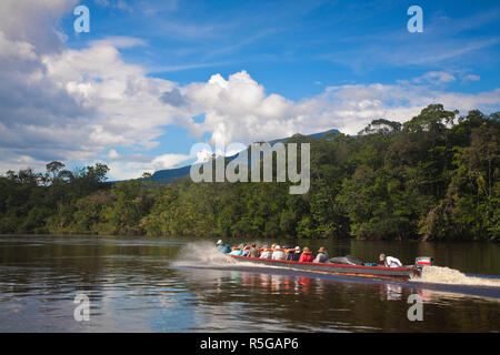 Venezuela, Guayana, Canaima National Park,  Tourists on Boat trip to Angel Falls Stock Photo