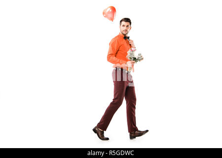 Handsome man with bouquet of flowers and red balloon isolated on white Stock Photo