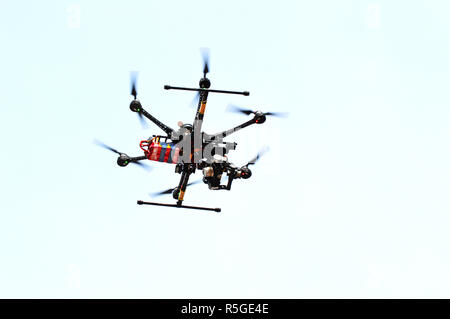 drone flying in the sky with camera / technology air drone flying and taking pictures on top view Stock Photo