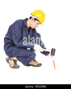 Man hold hammer and cold chisel on white Stock Photo
