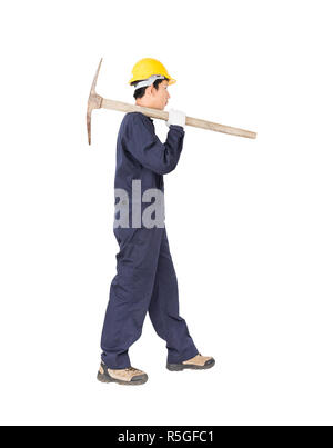 Man in uniform hold old pick mattock that is a mining device Stock Photo