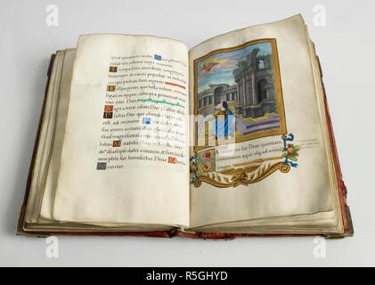 An open missal written in Latin rests on a wooden lectern decorated ...