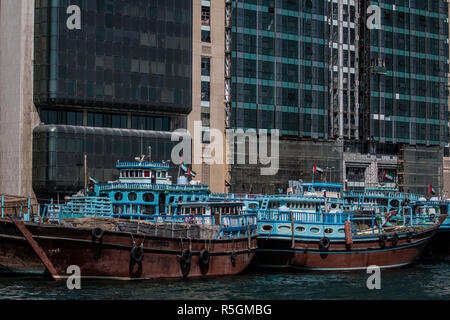 Vintage wooden barges moored in Dubai Creek, waiting for loading, United Arab Emirates Stock Photo