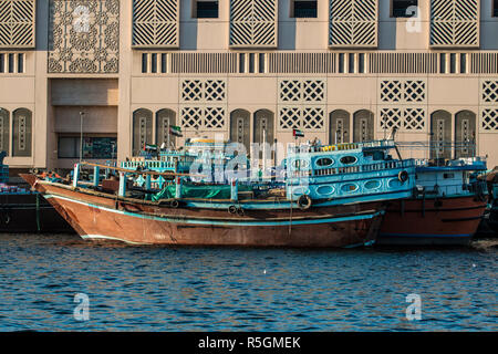 Vintage traditional wooden cargo ships moored in Dubai Creek, United Arab Emirates Stock Photo