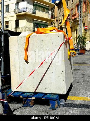 Concrete block being used as ballast Stock Photo