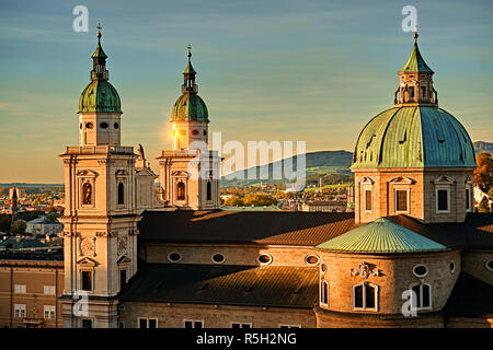 Beautiful sunset view of Salzburg Cathedral (Dom zu Salzburg) at Residenzplatz square in summer in Salzburg, Salzburger Land, Austria. Stock Photo