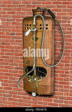 Vintage gas water heater with shower on wall of bricks. Retro Instantaneous  water heater with tap Stock Photo - Alamy