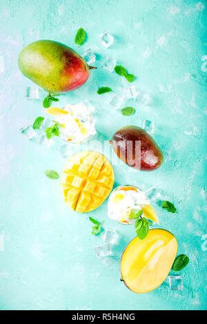 Mango slices and cubes with fresh mango smoothie. Top view Stock Photo ...