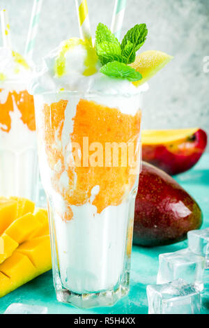 Mango slices and cubes with fresh mango smoothie. Top view Stock Photo ...