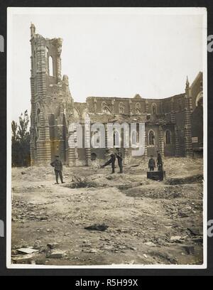 A shell wrecked church in France [Laventie]. General view of the ruined church, with soldiers in the foreground. 9 August 1915. Record of the Indian Army in Europe during the First World War. 20th century, 9 August 1915. Gelatin silver prints. Source: Photo 24/(287). Author: Girdwood, H. D. Stock Photo