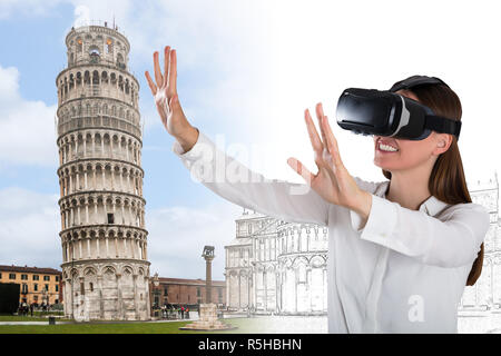 Smiling Young Woman Wearing Virtual Reality Glasses Stock Photo