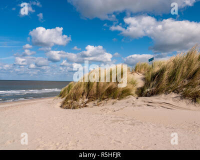 Dune covered with grass in the front of the noth sea at the beach in Niew Hamstede on the island Walcheren in the Netherlands Stock Photo