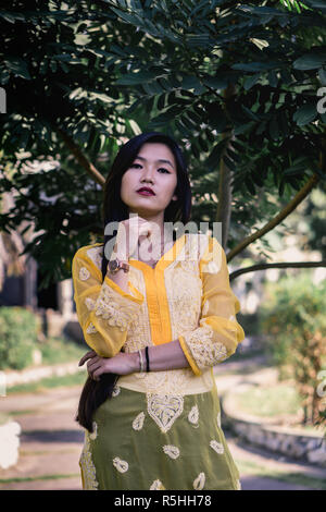 Girl in Chikankari Kurti by Zahba posing for the camera in a park. Stock Photo