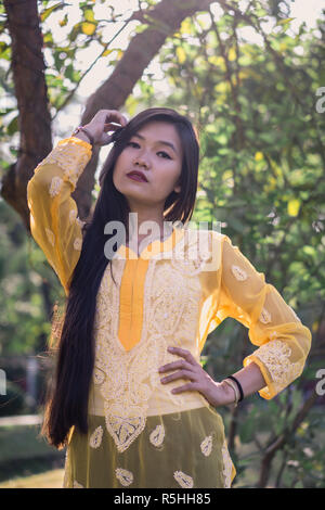 Girl in Chikankari Kurti by Zahba posing for the camera in a park. Stock Photo