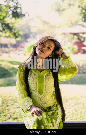 Girl in Chikankari Kurti by Zahba posing for the camera in a park Stock  Photo - Alamy