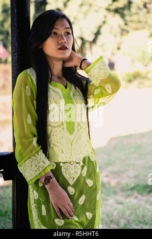 Girl in Chikankari Kurti by Zahba posing for the camera in a park. Stock Photo