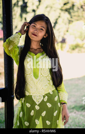 Girl in Chikankari Kurti by Zahba posing for the camera in a park. Stock Photo