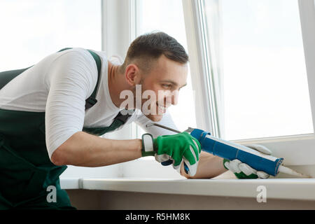 Young man doing repair Stock Photo