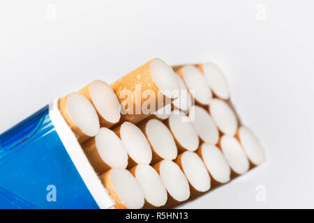 Open pack of cigarettes with a one protruding cigarette closeup Stock Photo