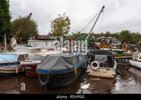 Derelict canal boats at Charity Dock on the Coventry Canal, Bedworth, Warwickshire, England, UK (WOP) Stock Photo