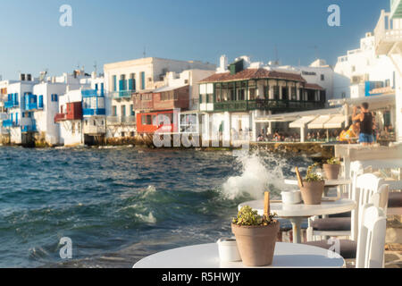 Seaside bar in Little Venice basking in late afternoon sunshine, Mykonos, Greece, 2018 Stock Photo