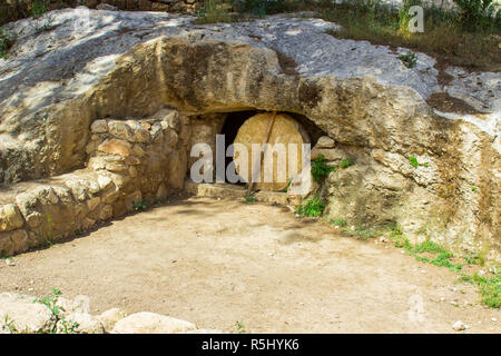 An authentic representation of a  jewish Garden Tomb with stone door in ithe Nazareth Village open air museum in Nazareth Israel. This museum gives an Stock Photo