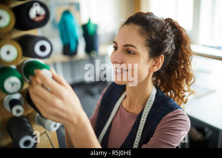 Choosing threads for sewing Stock Photo