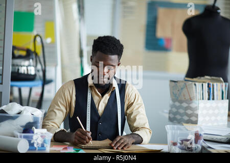 Fashion designer by workplace Stock Photo