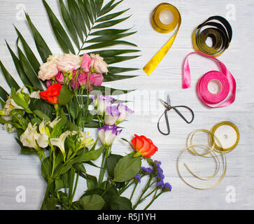The florist desktop with working tools on wooden background Stock Photo