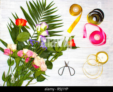 The florist desktop with working tools on wooden background Stock Photo