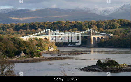 Menai suspension bridge, crossing the Menai Straits, connecting the Welsh mainland with The Isle of Anglesey. Image taken in October 2018. Stock Photo