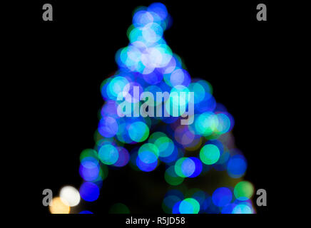 Christmas tree multicoloured lights, blurred to give an abstract effect. Stock Photo