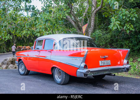 Vintage red 1957 Chevrolet Bel Air parked on a road near Jibacoa Cuba. Stock Photo