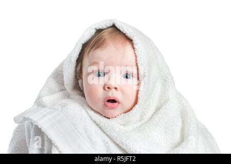 Cute surprised Baby in fluffy towel after bathing isolated on white background. Concept of hygiene, childcare.