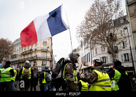 Protestors clash with police in central Paris, December 1, 2018. 1st Dec, 2018. The ''Yellow Vest'' movement began across France against gas tax hikes proposed by the Macron administration, but has grown over several weeks to represent overall dissatisfaction with the cost of living. Credit: Michael Candelori/ZUMA Wire/Alamy Live News Stock Photo