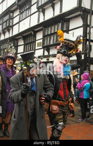 Rochester, Kent, UK. 1st December 2018: A couple dressed in Steampunk costume particiapte in the main parade on Rochester High Street. Hundreds of people attended the Dickensian Festival in Rochester on 1 December 2018. The festival's main parade has participants in Victorian period costume from the Dickensian age. The town and area was the setting of many of Charles Dickens novels and is the setting to two annual festivals in his honor. Photos: David Mbiyu/ Alamy Live News Stock Photo