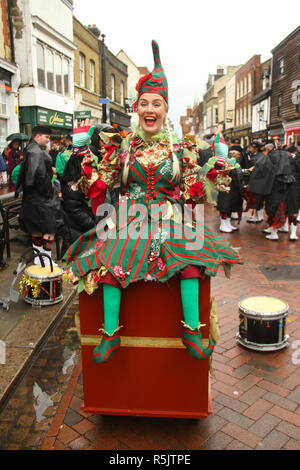 Rochester, Kent, UK. 1st December 2018: A participant of the Main parade entertains on Rochester High Street. Hundreds of people attended the Dickensian Festival in Rochester on 1 December 2018. The festival's main parade has participants in Victorian period costume from the Dickensian age. The town and area was the setting of many of Charles Dickens novels and is the setting to two annual festivals in his honor. Photos: David Mbiyu/ Alamy Live News Stock Photo