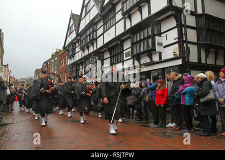 Rochester, Kent, UK. 1st December 2018: A bagpiper bang leads the main parade on Rochester High Street. Hundreds of people attended the Dickensian Festival in Rochester on 1 December 2018. The festival's main parade has participants in Victorian period costume from the Dickensian age. The town and area was the setting of many of Charles Dickens novels and is the setting to two annual festivals in his honor. Photos: David Mbiyu/ Alamy Live News Stock Photo