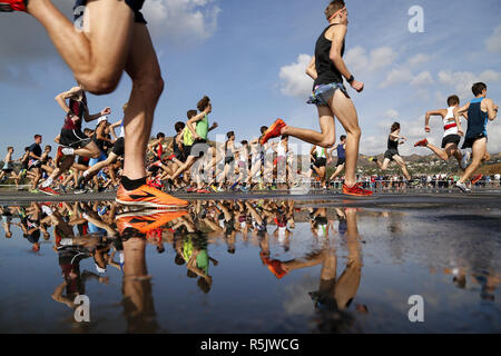 Walnut, CA, USA. 1st Dec, 2018. December 1, 2018 - Walnut, California, USA - High school runners are reflected at the start the Championship Boys Race at the Foot Locker Cross Country Championships West Regional at Mt. San Antonio College in Walnut, CA. Credit: KC Alfred/ZUMA Wire/Alamy Live News Stock Photo