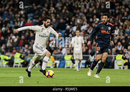 Madrid, Madrid, Spain. 1st Dec, 2018. Real Madrid's Francisco Alarcon 'Isco' and Valencia CF's Daniel Parejo seen in action during La Liga match between Real Madrid and Valencia CF at Santiago Bernabeu Stadium in Madrid, Spain. Credit: Legan P. Mace/SOPA Images/ZUMA Wire/Alamy Live News Stock Photo